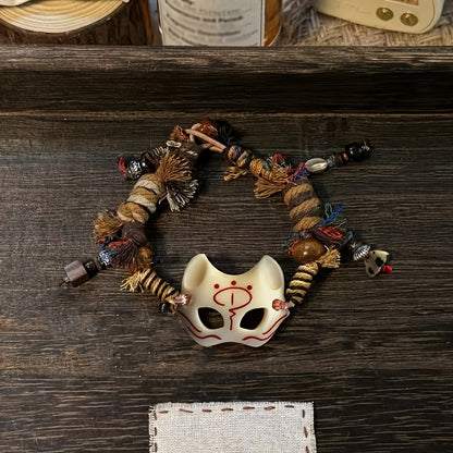 A Vintage Tribal Fox Mask Beaded Bracelet Featuring a Woven Rope Design in Tibetan Style, Serving As a Good Luck Charm. It'S Suitable for Everyday Wear Throughout The Seasons And Makes a Unique Accessory. This Is an Ideal Val